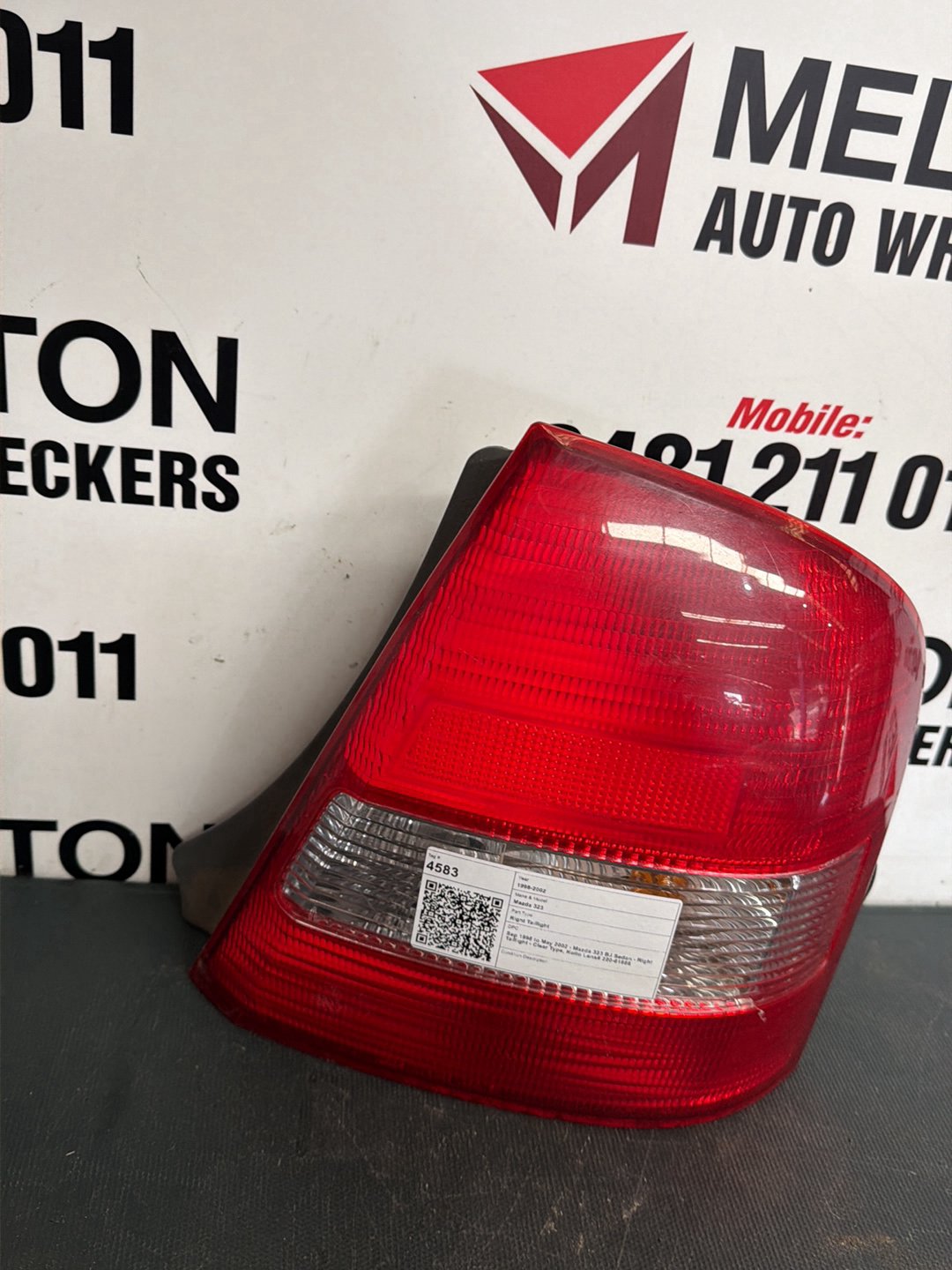 Sep 1998 to May 2002- Mazda 323 BJ Sedan- Right Taillight- Clear Type, Koito Lens# 220-61866